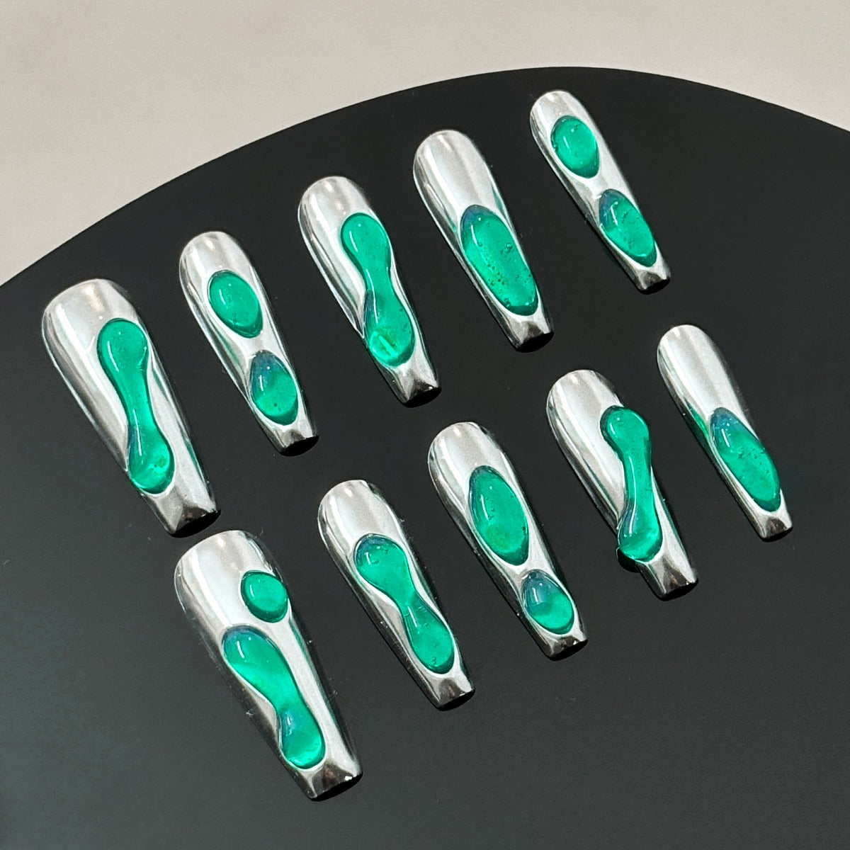 chrome nails with green accent liquid 3d design long coffin shaped front view ten pieces